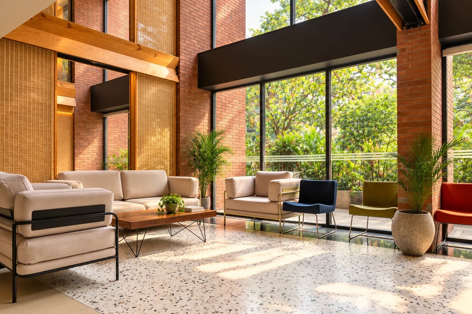 A lounge at ClayWorks 371 with brick walls, terrazzo flooring and garden views